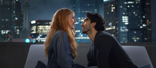 Blake Lively and Justin Baldoni embrace against the backdrop of the Boston skyline in 'It Ends with Us'.