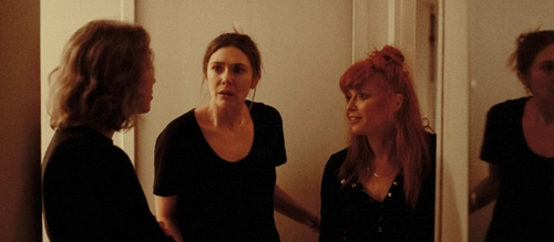 Carrie Coon, Elizabeth Olsen and Natasha Lyonne in 'His Three Daughters' (2024).